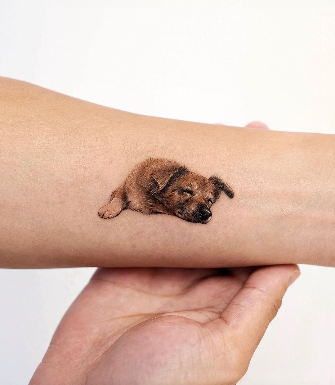 Small dog tattoo for men by paw.tattoo