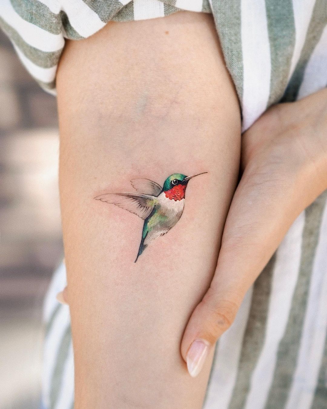 Small hummingbird tattoo by abii tattoo