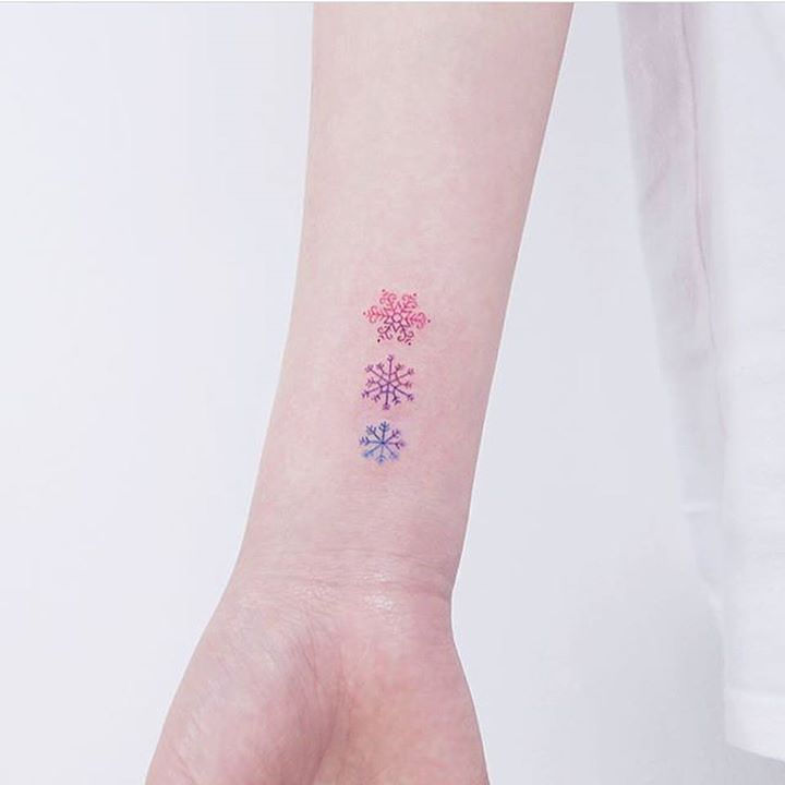 Small watercolor snowflake design by little.tattoos