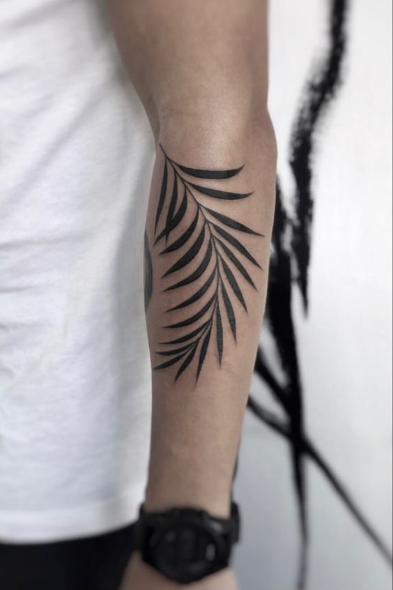 black inked leaf tattoo