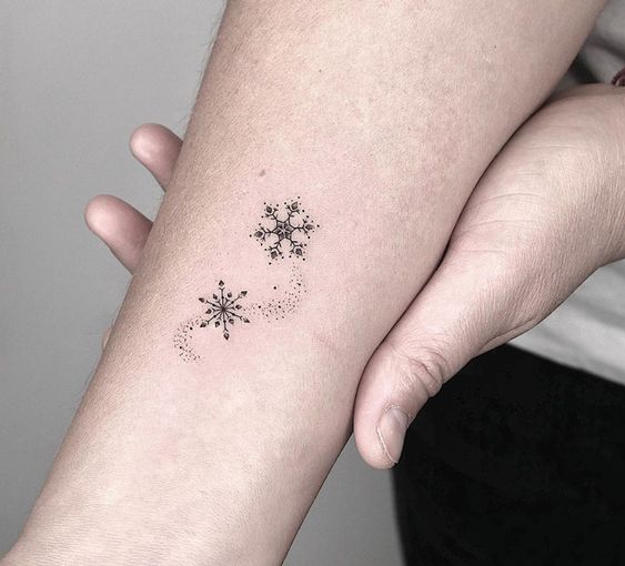 minimalistic snowflake tattoo