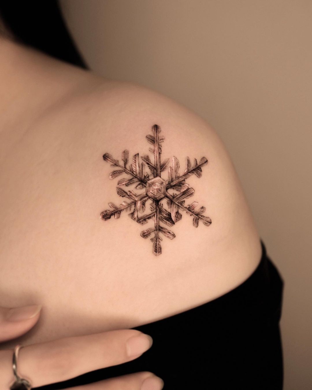 shoulder snowflake tattoo design by moco tattoo