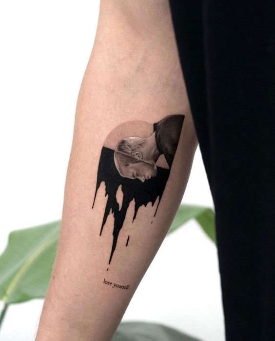 surrealistic arm tattoo