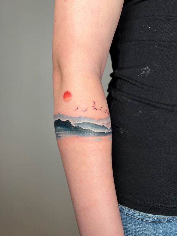 watercolor abstract mountain tattoo