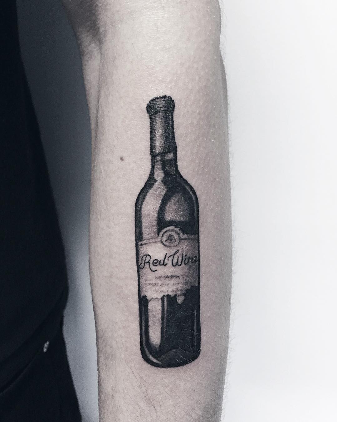 wine bottle tattoo by sergetattooer