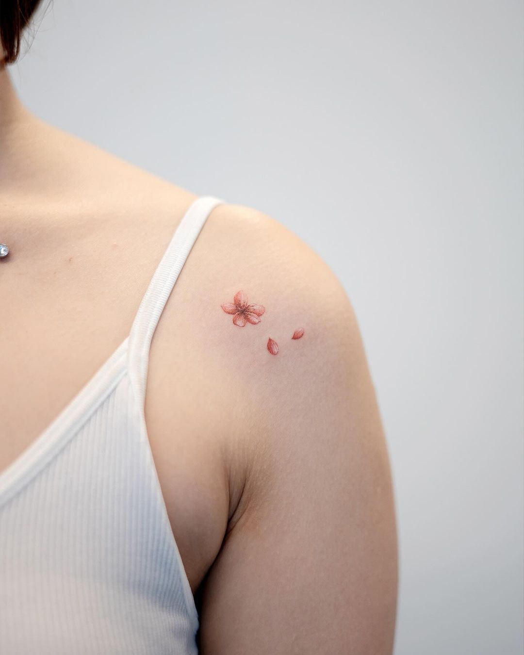 Minimalistic cherry blossom tattoo by handitrip