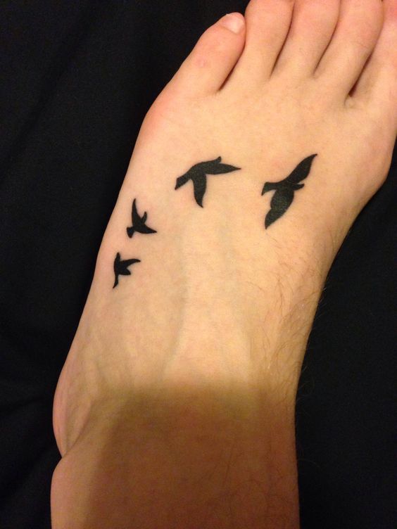 black inked bird tattoo