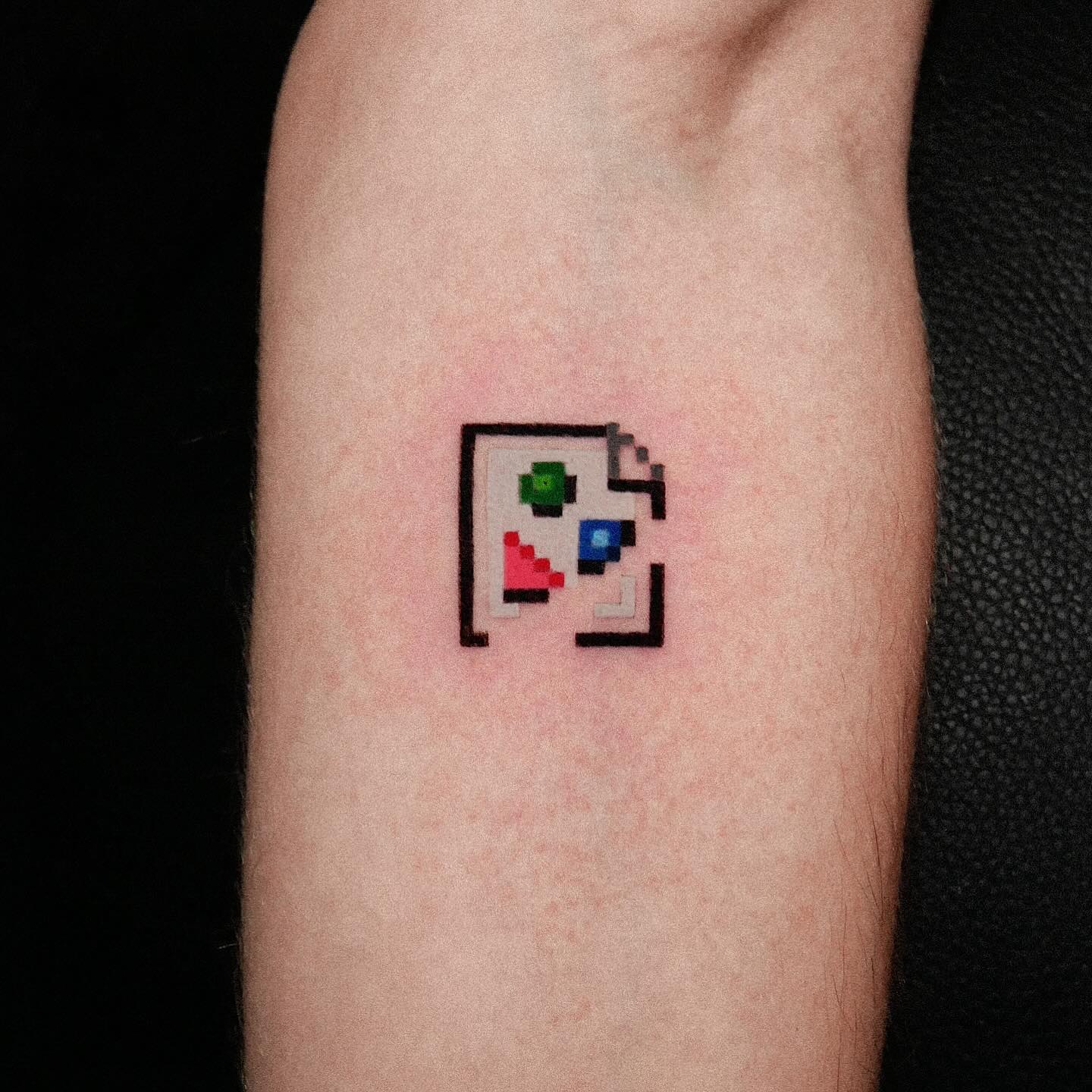 colorful game tattoo by fimmtattooer