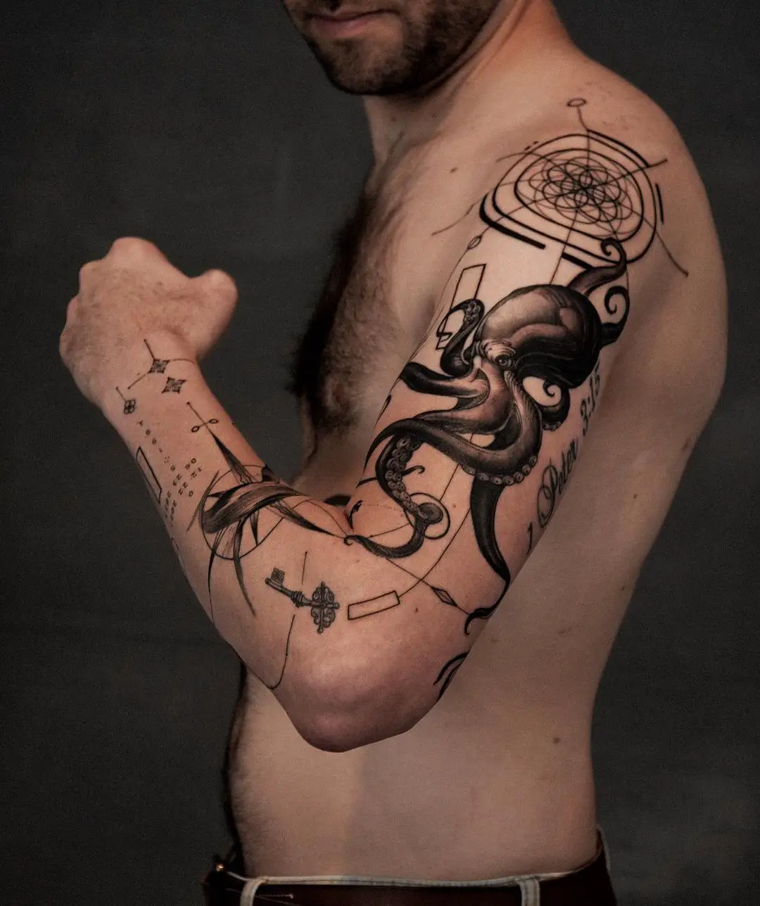 geometric octopus tattoo by soma.tattoostudio
