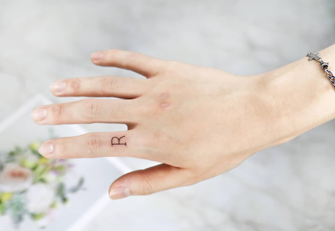 initial ring tattoo by yujin tattoo