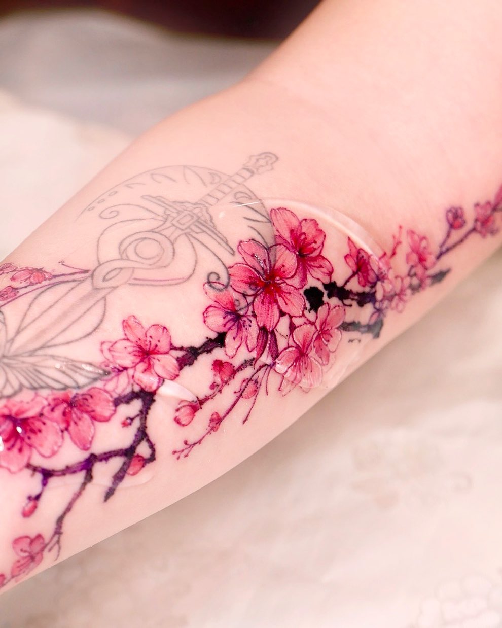 pink cherry blossom tattoo by seolheetattoo