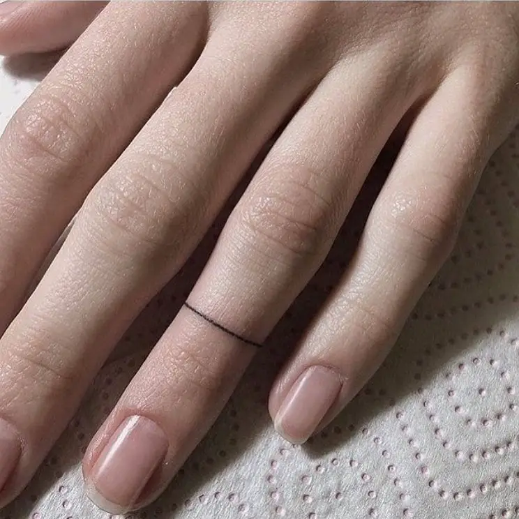 simple ring tattoo for women by tinytattooinc