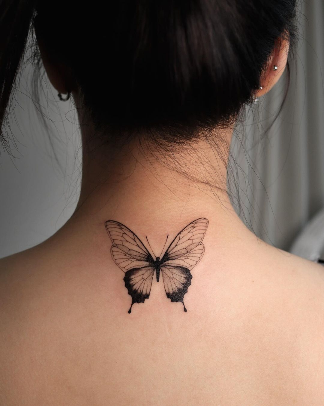 Black and grey butterfly tattoo by tattoo chamsae