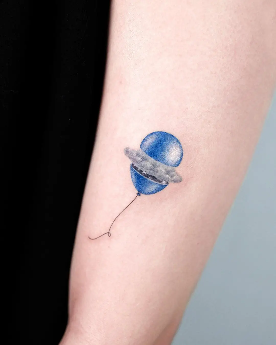 Blue balloon tattoo by tattooist basil