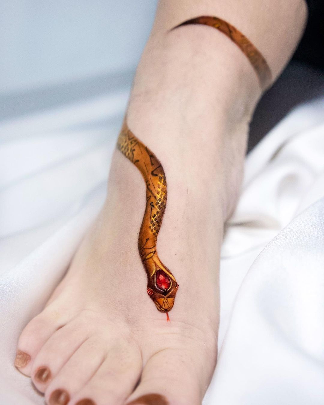 Realistic snake tattoo by