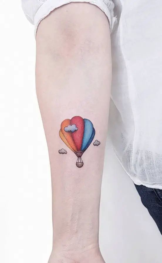 balloon tattoo on forearm