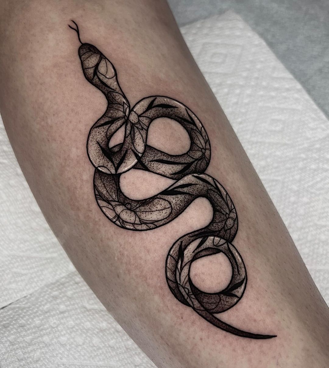 small snake tattoo by brii.fletchtattoos