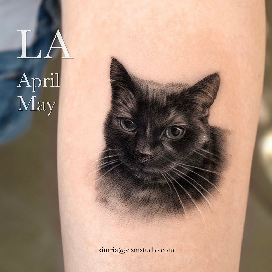 Black cat tattoo by tattooist kimria