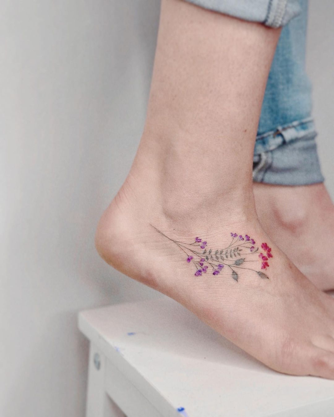 Floral tattoos on foot by eva tattooist