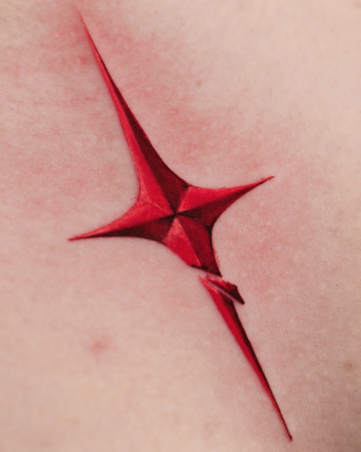 Red ink tattoo for men by kelvintattooer