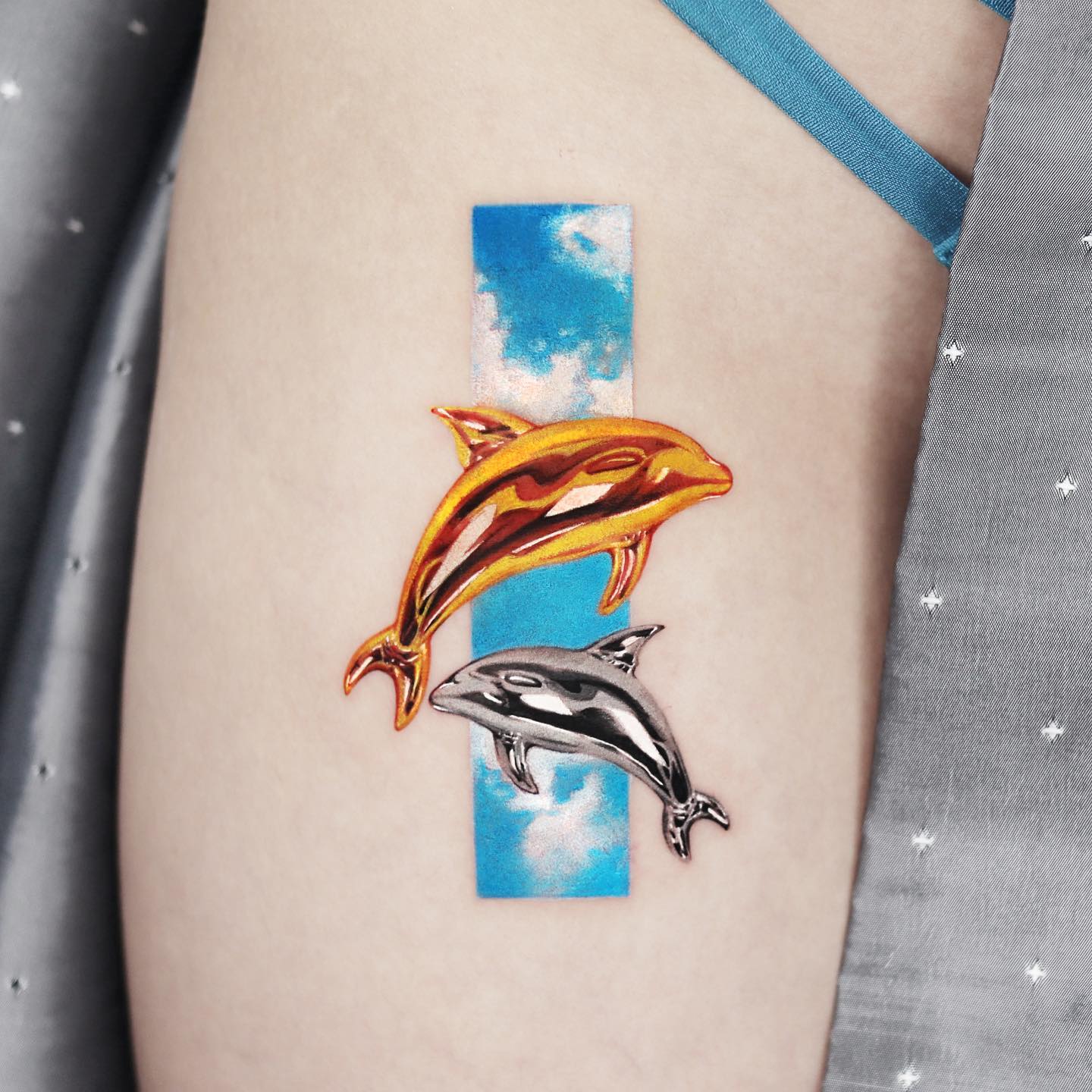 cute dolphin tattoo design by jooa tattoo