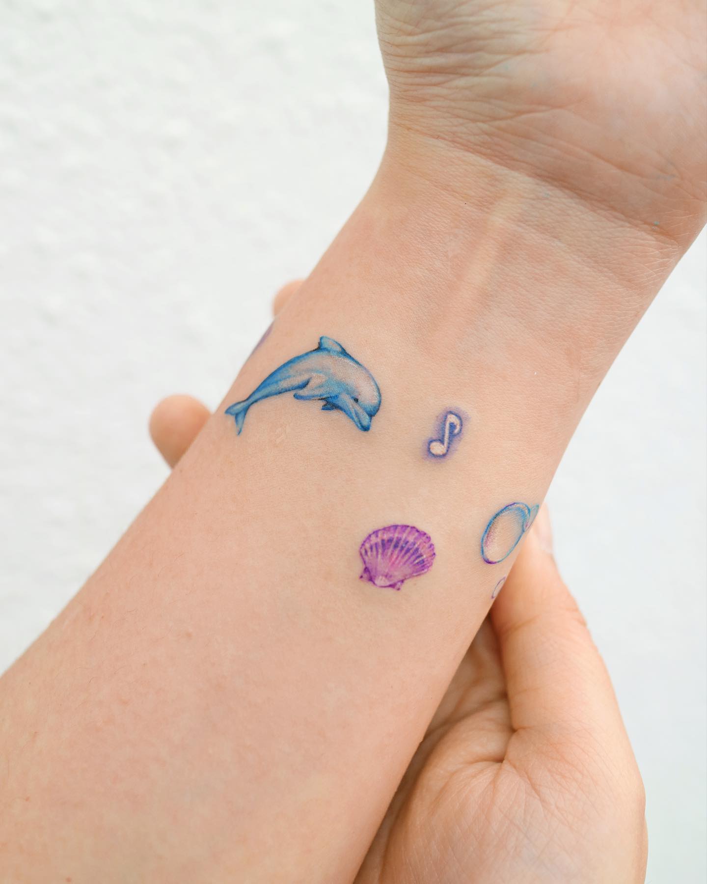 dolphin on forear by tattooist yun
