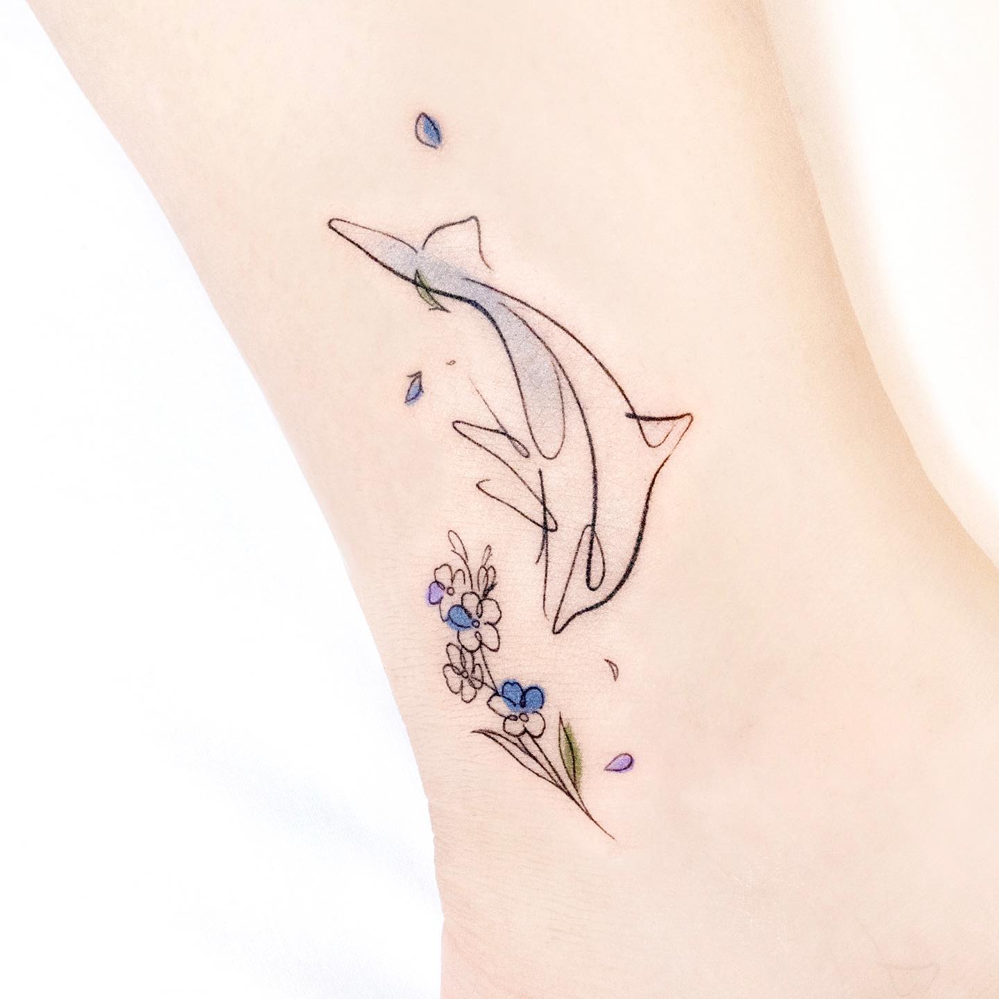 floral dolphin tattoos by heim tattoo