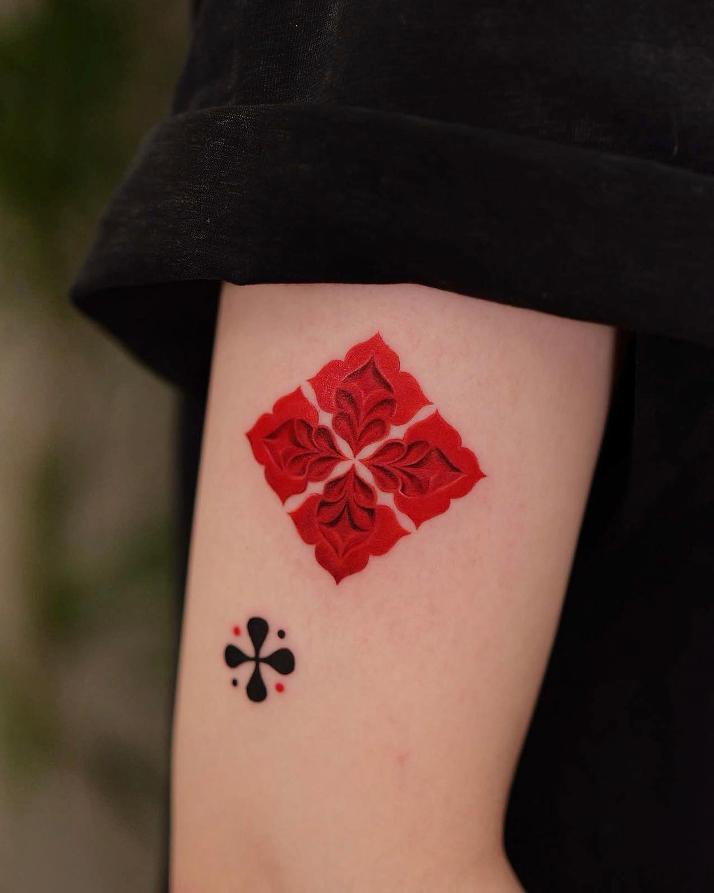 red ink forearm tattoo by newtattoo studio