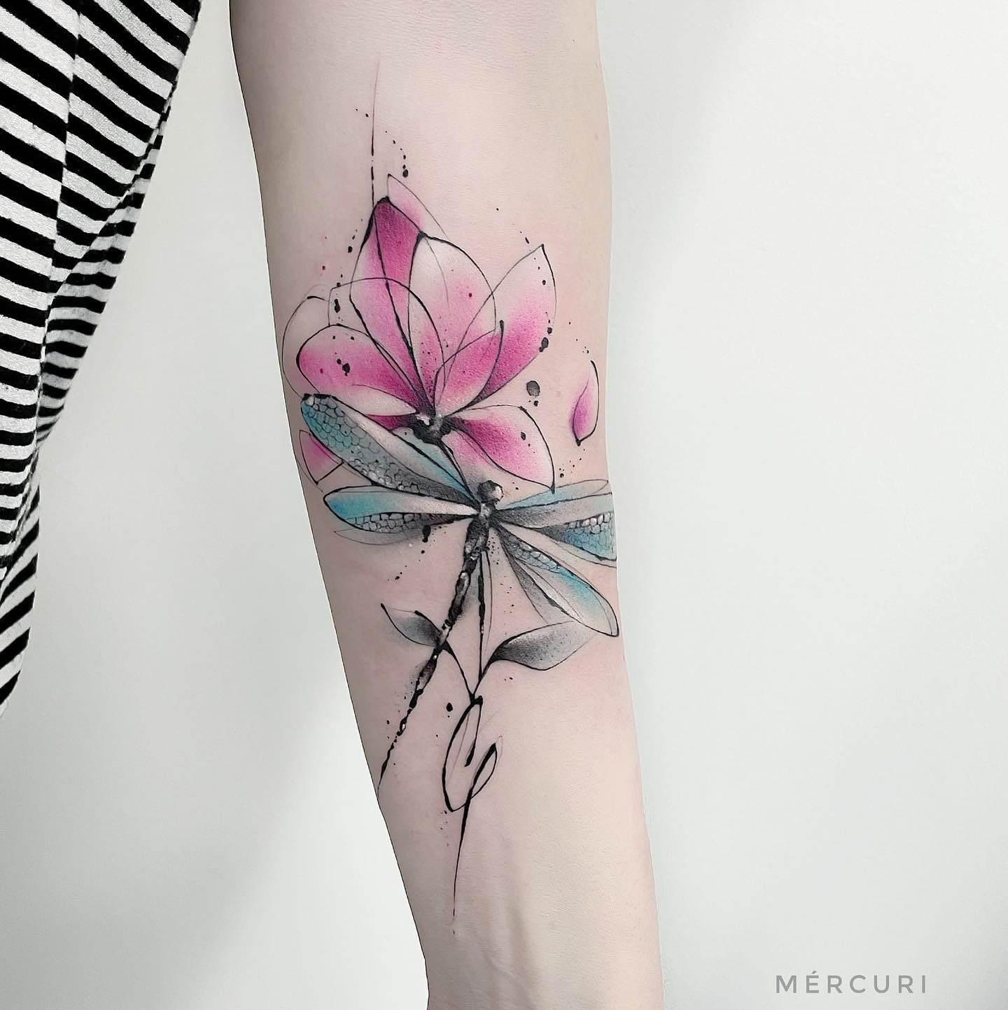 watercolor tattoo on forearm by mercuri michele
