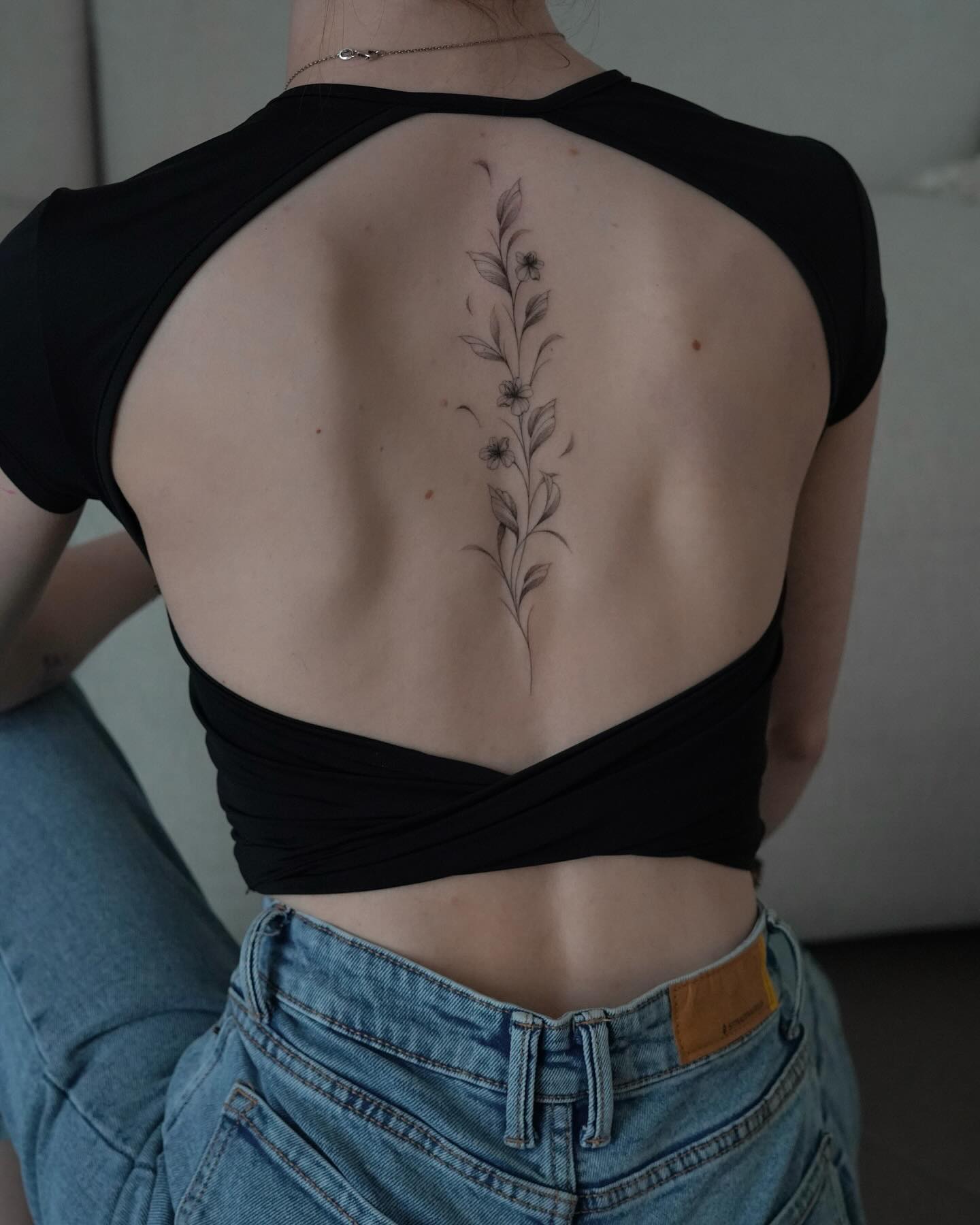 Floral spine tattoos by lindacanters tattoo