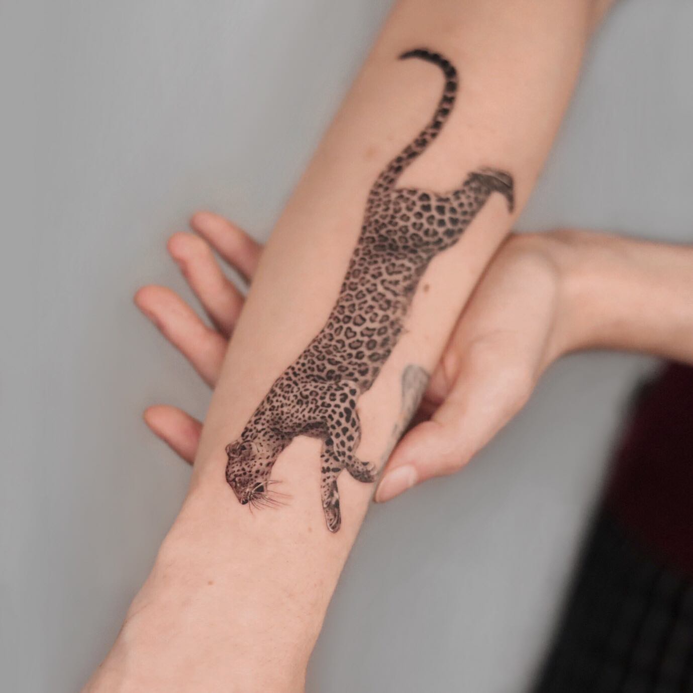 leopard arm design by dzess.tattoo