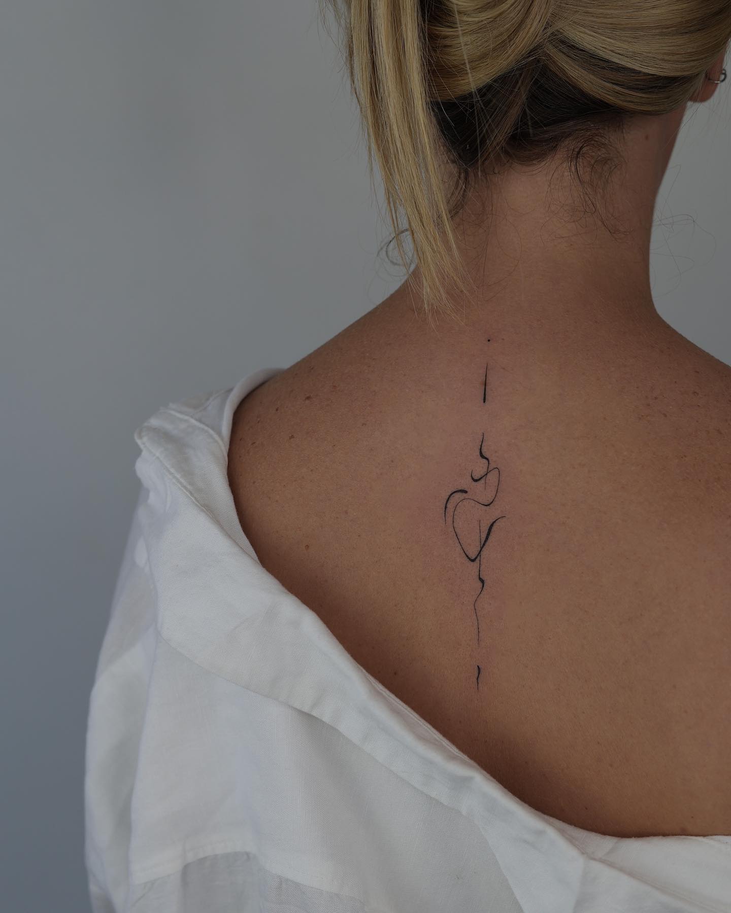 unique spine design by akkurat tattoo