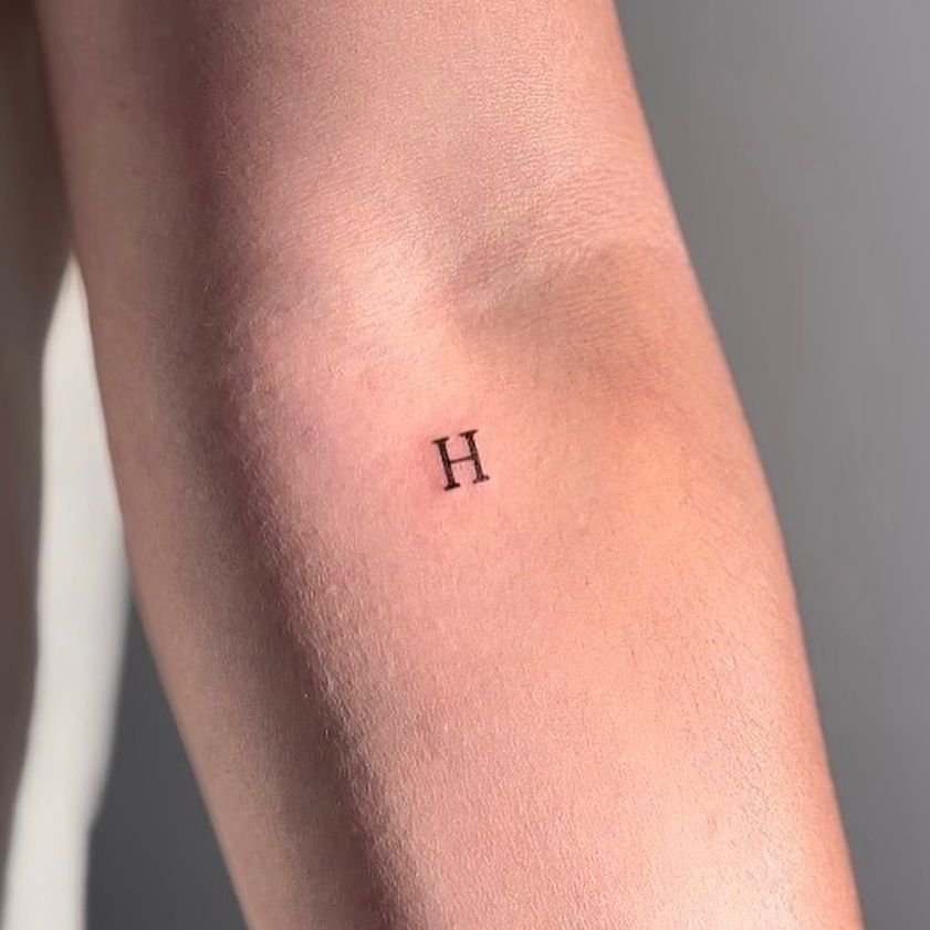 Minimal alphabet tattoo by mokistudios