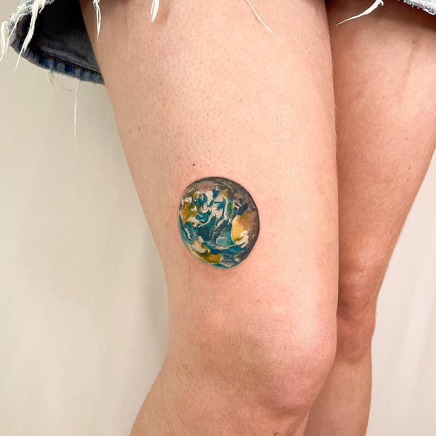 watercolor earth tattoo design by inkynas