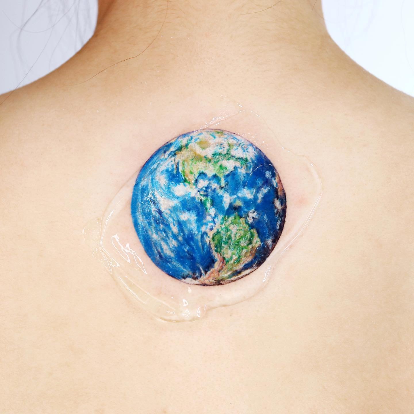 watercolor earth tattoos by guseul tattoo