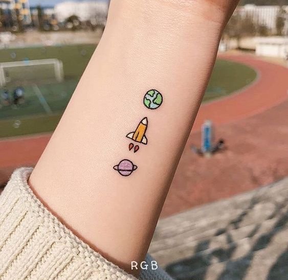 Space on rocket tattoo