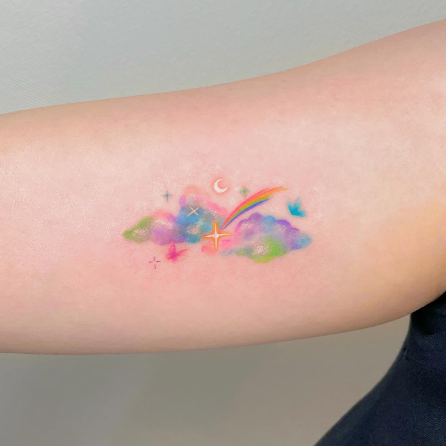 Rainbow tattoo design by plastic tattoo