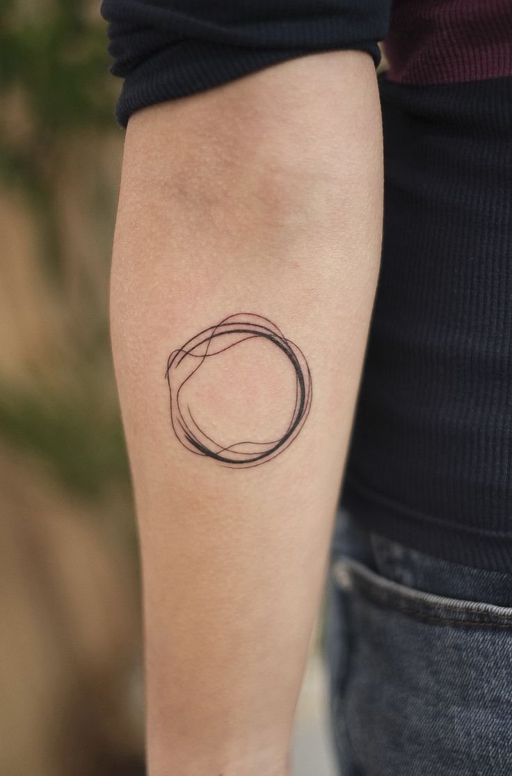 Fineline tattoo with a circle