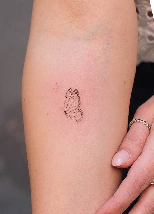 Fineline minimal butterfly tattoo