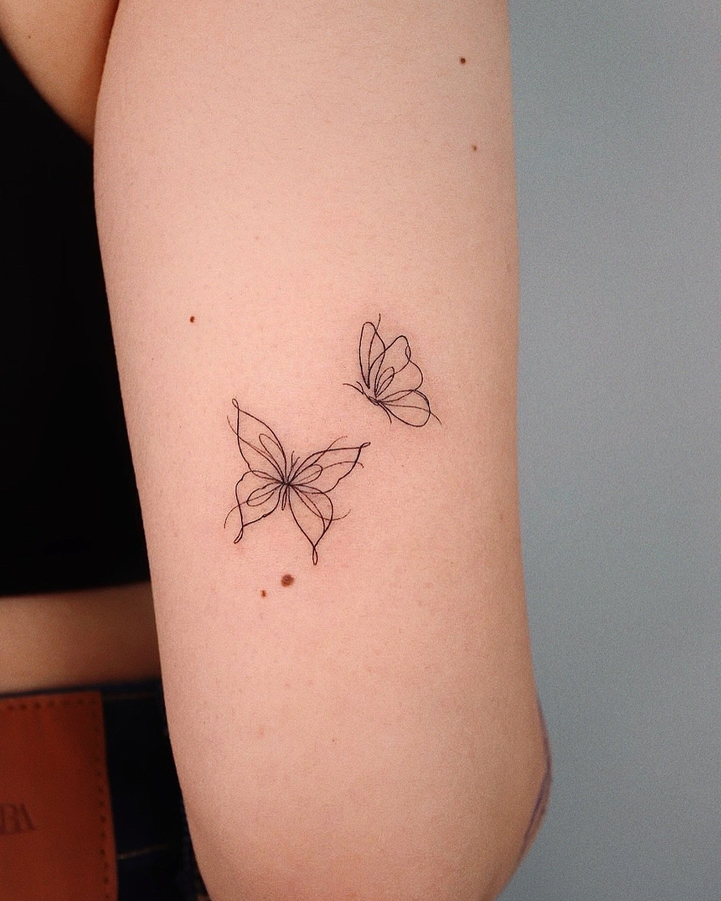 Fineline minimal tattoo design by yeowool tattooer 1